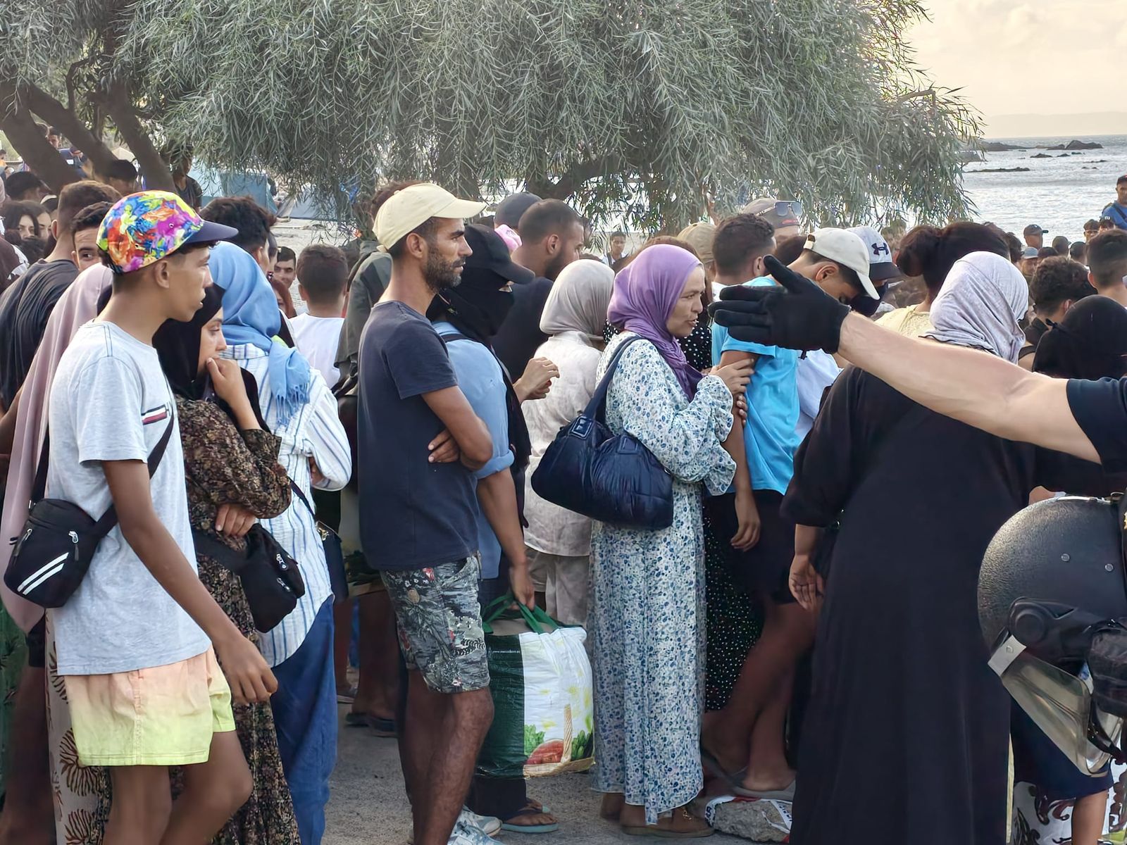 Migrantes en la Playa del Trampolín