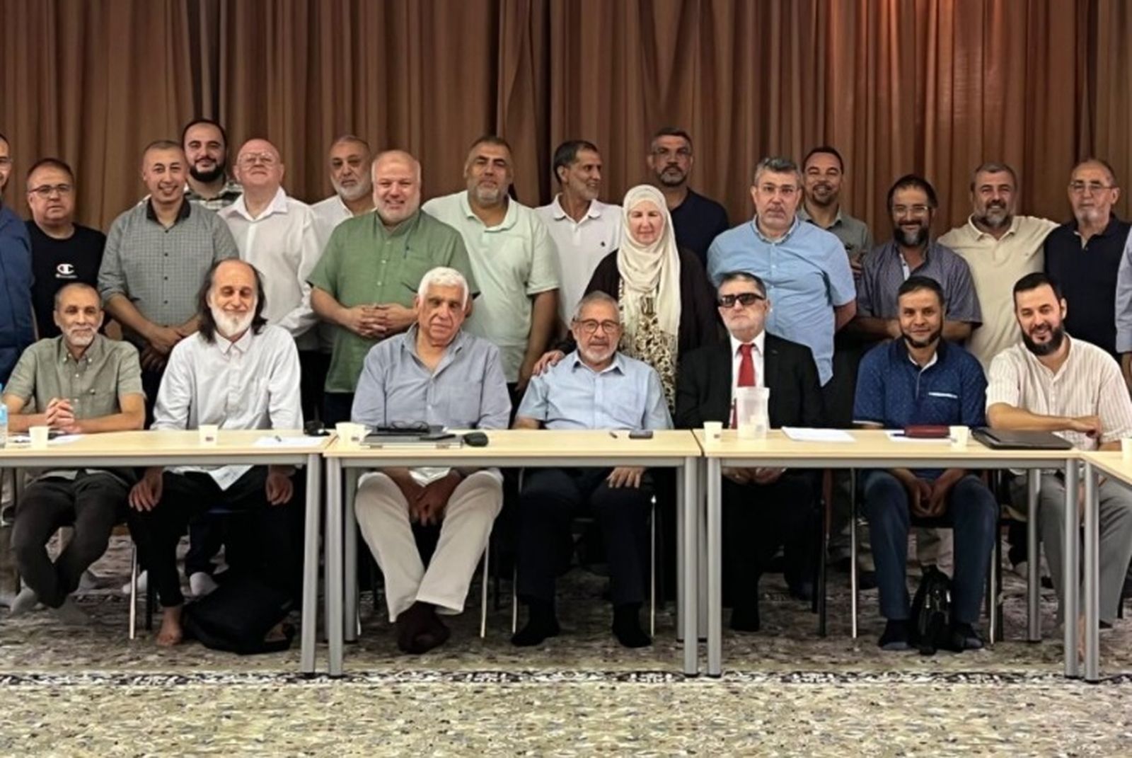 Aiman Adlbi (centro) durante la Comisión Permanente de la Comisión Islámica de España celebrada en Madrid en julio de 2024