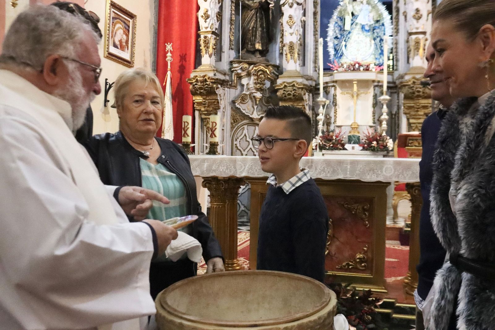 Daniel, Adrián y Noel reciben el Sacramento del bautismo