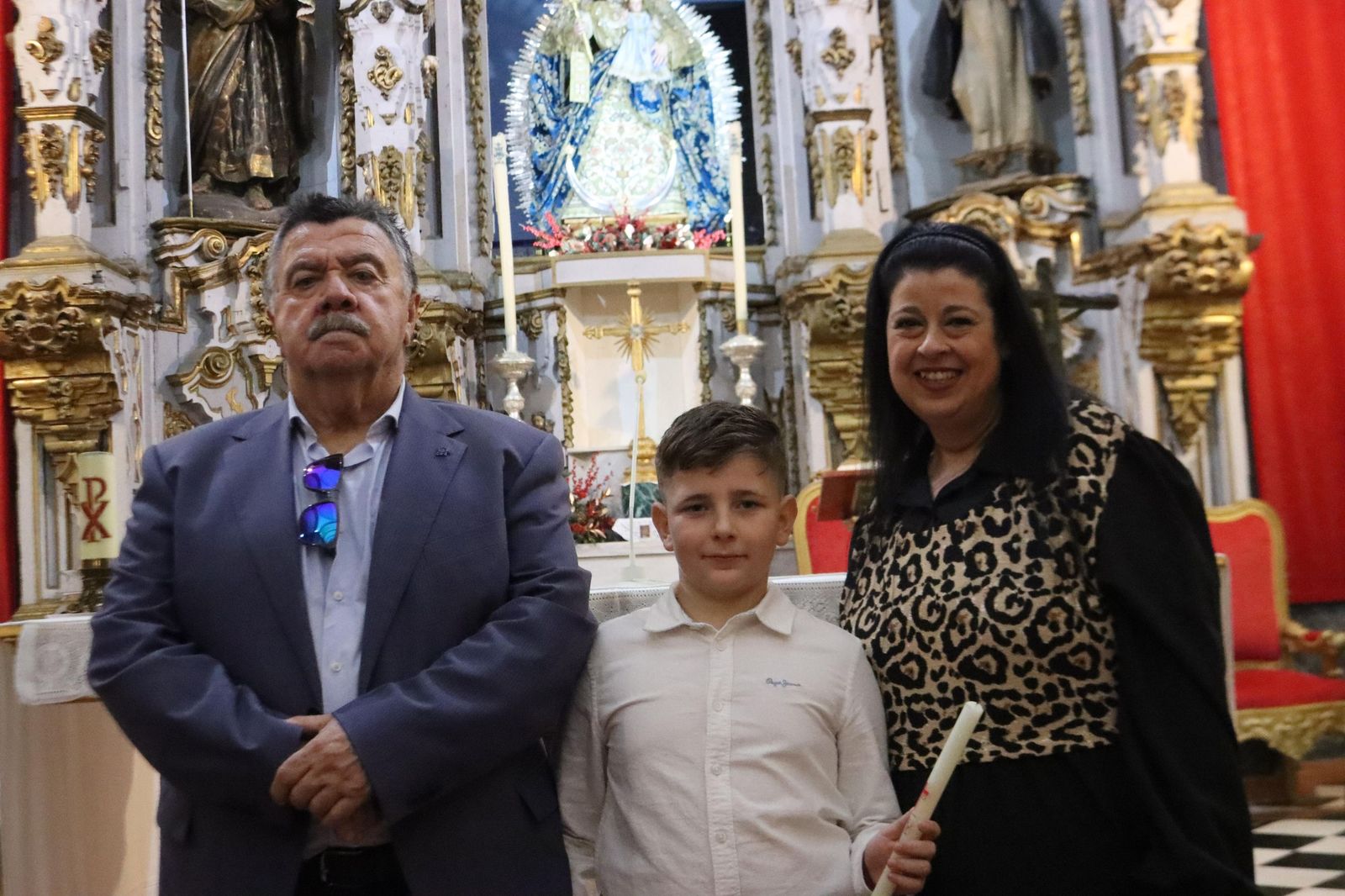 Daniel, Adrián y Noel reciben el Sacramento del bautismo
