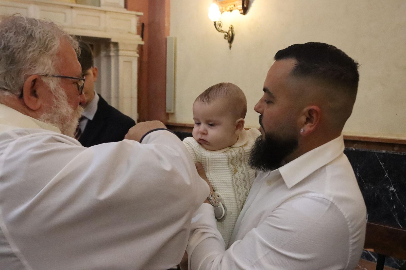 Daniel, Adrián y Noel reciben el Sacramento del bautismo