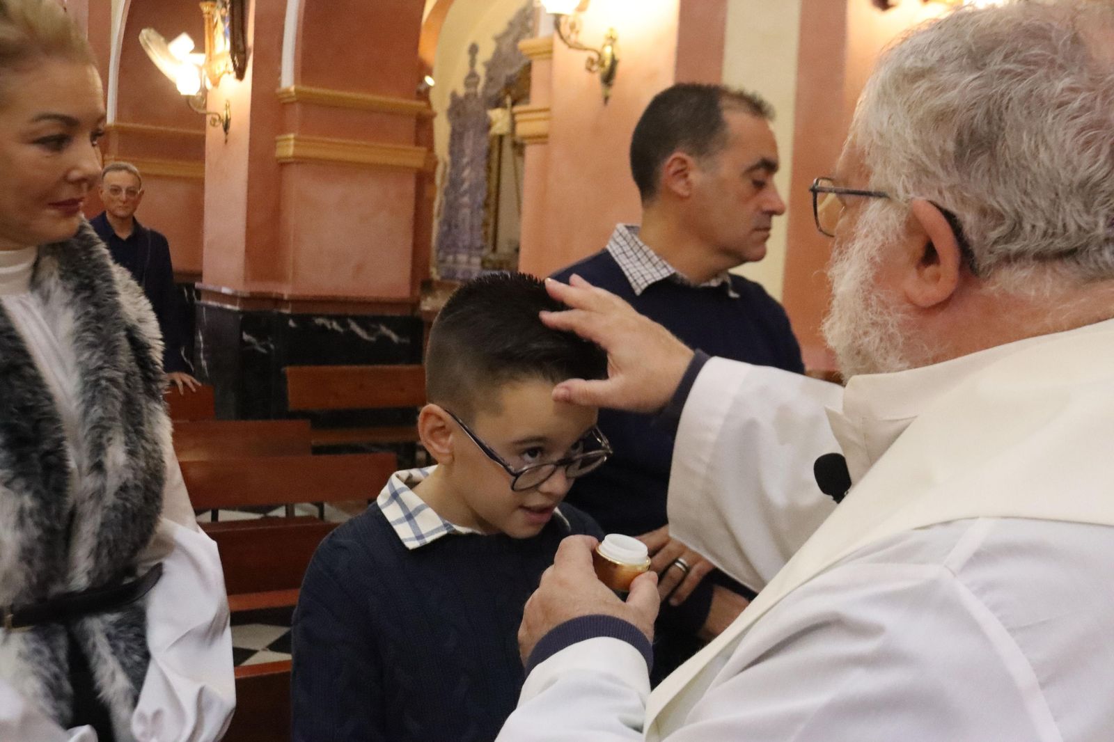 Daniel, Adrián y Noel reciben el Sacramento del bautismo