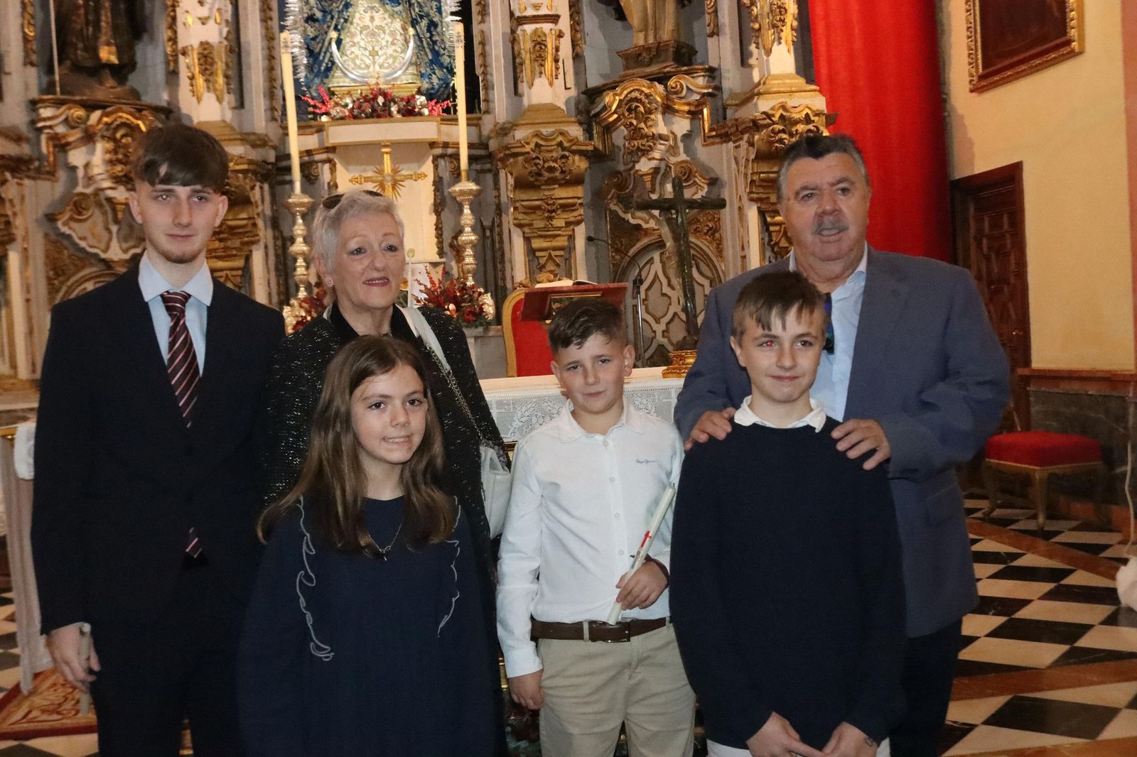 Daniel, Adrián y Noel reciben el Sacramento del bautismo