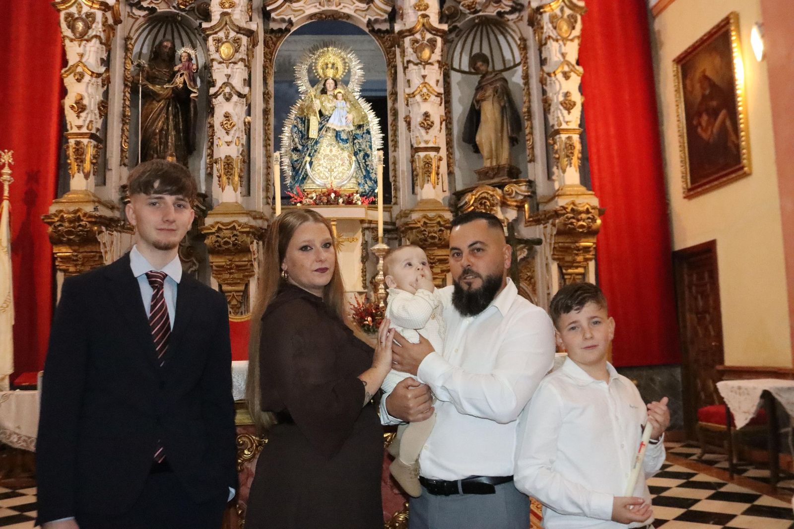 Daniel, Adrián y Noel reciben el Sacramento del bautismo