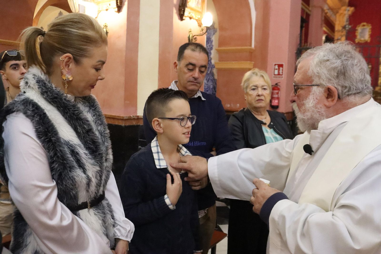 Daniel, Adrián y Noel reciben el Sacramento del bautismo