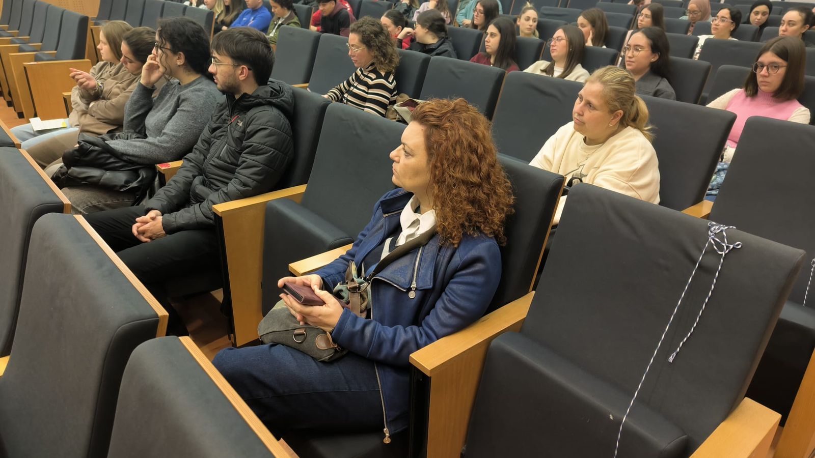 Asistentes en el Salón de Actos del Campus de Ceuta durante la jornada de la ONCE este martes