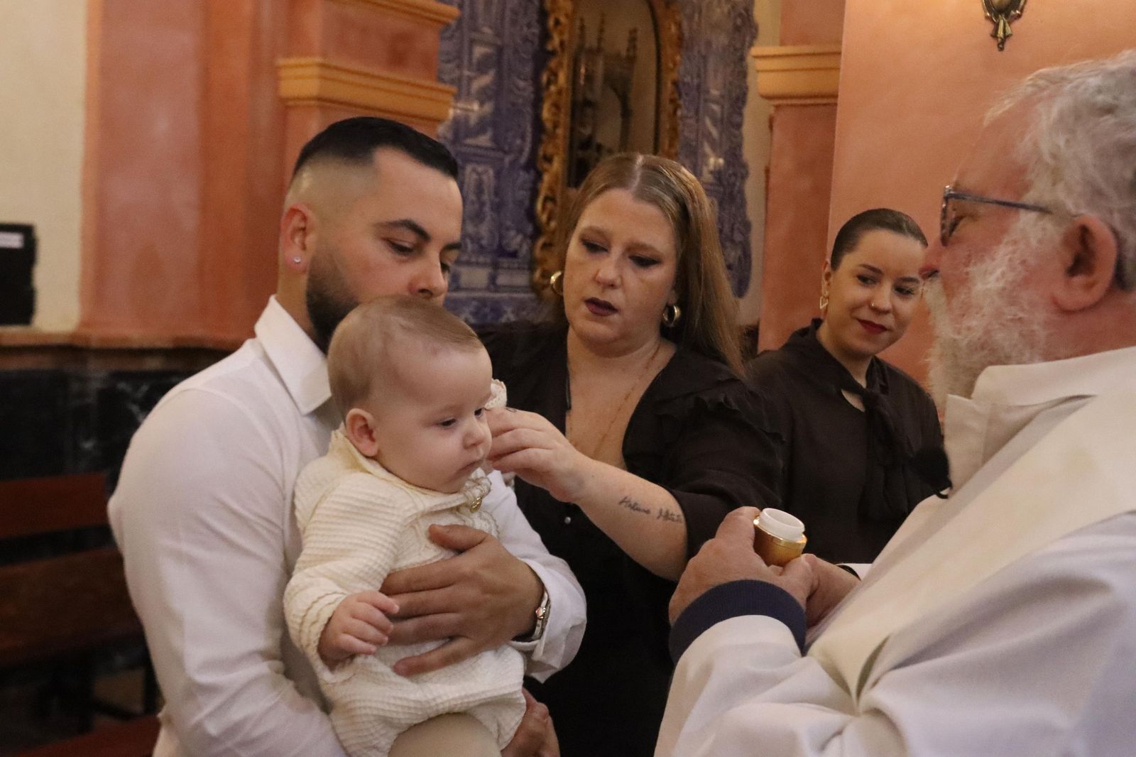 Daniel, Adrián y Noel reciben el Sacramento del bautismo