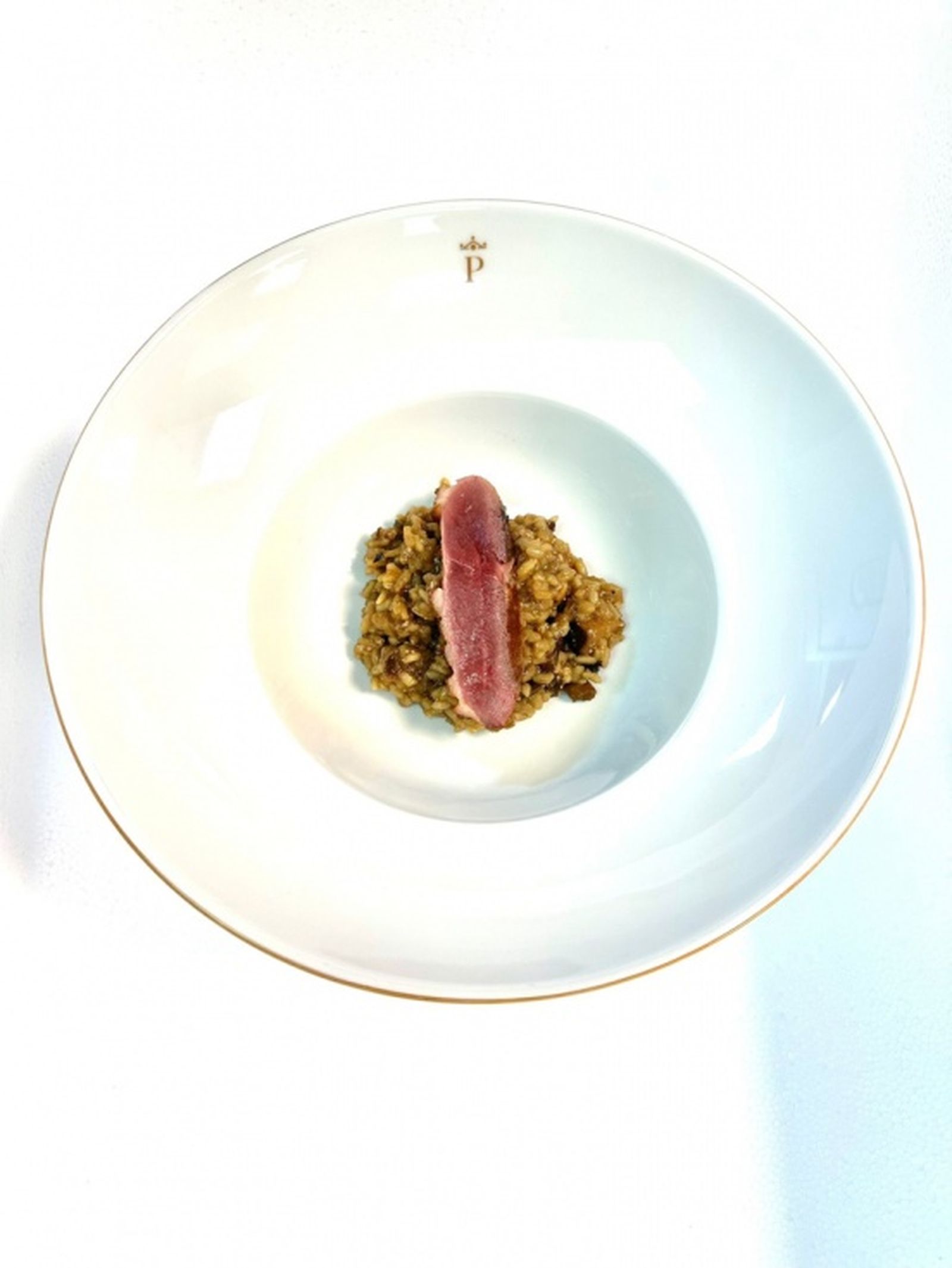 arroz es de setas y boletus con magret de pato. / CEDIDA